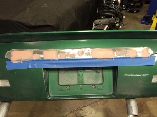 Green back bumper repair of a car